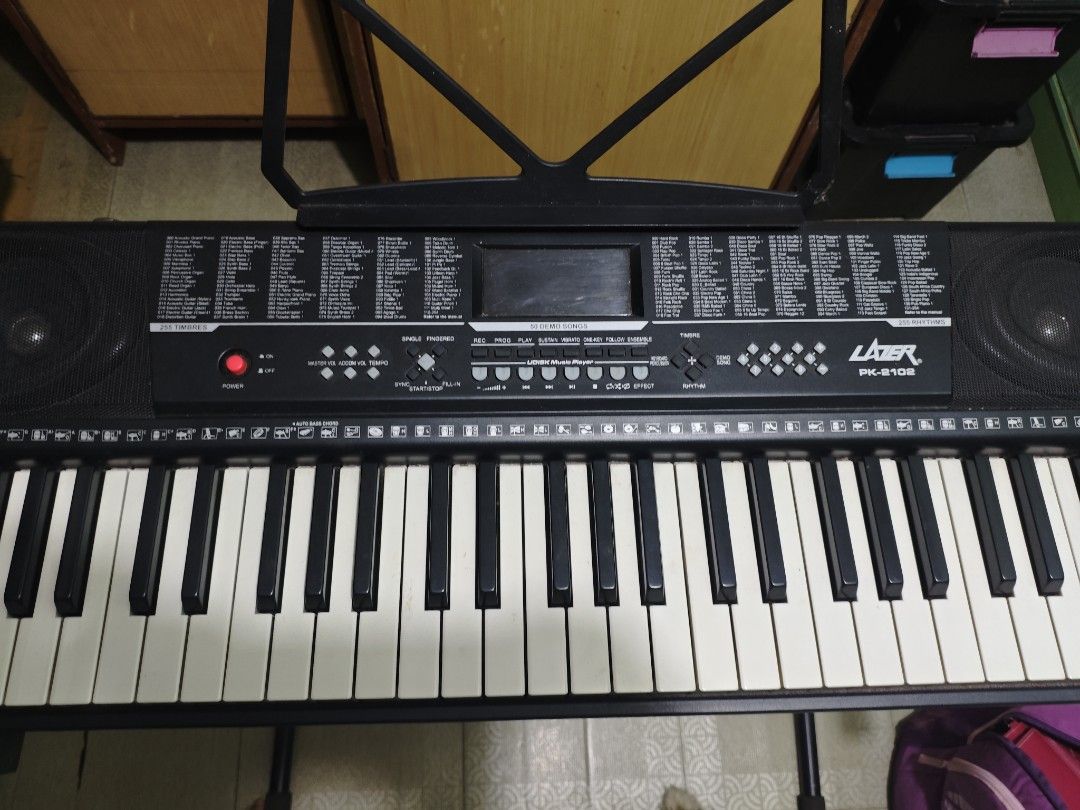 Lazer PK-2102 61 Keys Keyboard with Stand (Category: Musical Instruments) located in Las Pinas. Submitted by sofaking69 (Listing ID 1441723325, Image 3). Description: - Lazer PK-8700 Keyboard - Includes sturdy X-stand, music rest, and dust cover - Variety of instrument sounds and rhythms - Perfect for beginners or practice sessions - Tested and confirmed working - Sold as is - 1 month used.