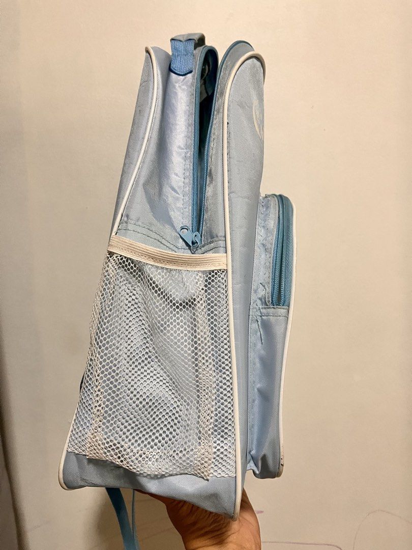 Light Blue Cinnamoroll Backpack (Category: Backpacks) located in Quezon City. Submitted by cthy27 (Listing ID 1441638960, Image 2). Description: - Adorable light blue backpack featuring a Cinnamoroll graphic. - Main compartment for storage. - Convenient front pocket for quick access. - Side mesh pockets ideal for water bottles. - Adjustable straps for a comfortable fit. - Shows minor marks and scuffs from previous use. - Great for school, travel,