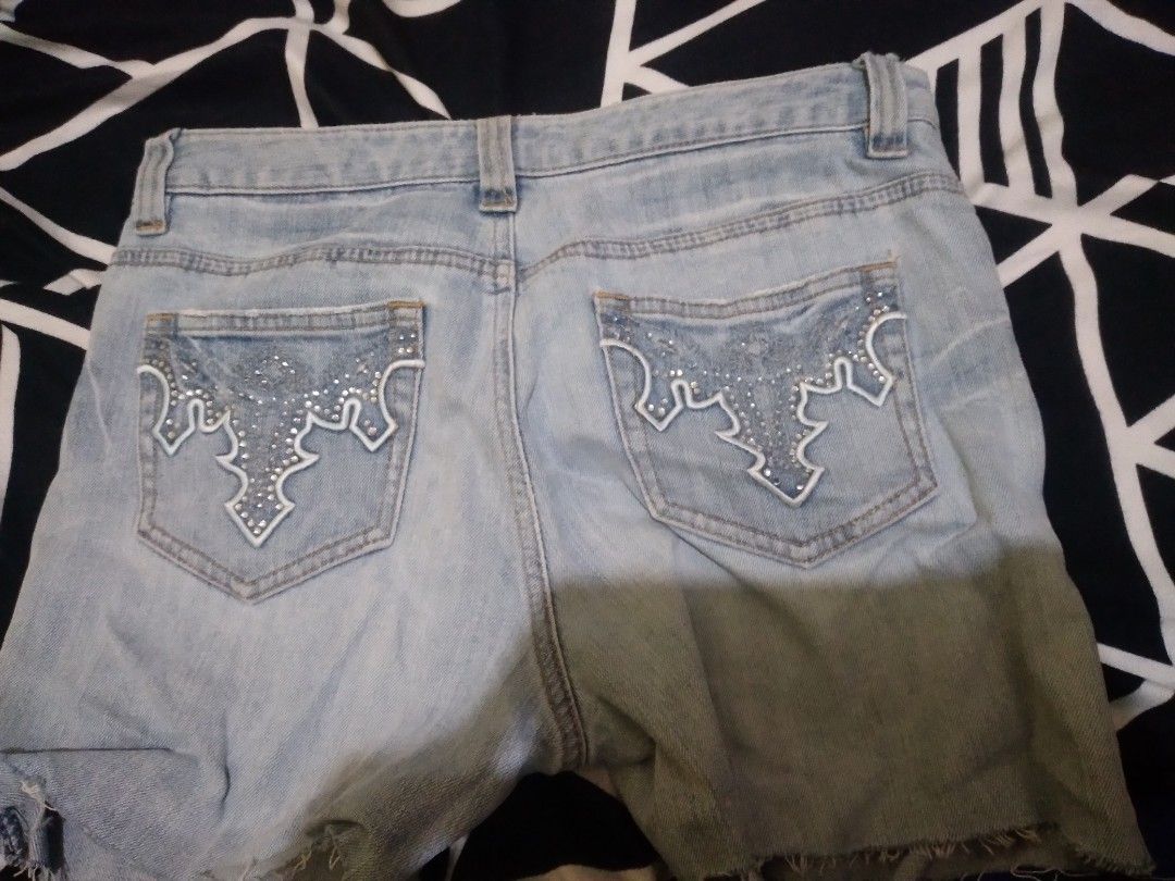 Light Wash Denim Shorts with Rhinestone Pockets (Category: Shorts) located in Agdangan. Submitted by nanachiix (Listing ID 1441718496, Image 2). Description: - Cute light wash denim shorts - Frayed hem for a casual look - Rhinestone detailing on back pockets - Waist: 64cm - Inseam: 65cm - Material: 98% Cotton, 2% Polyurethane - Ideal for summer wear.
