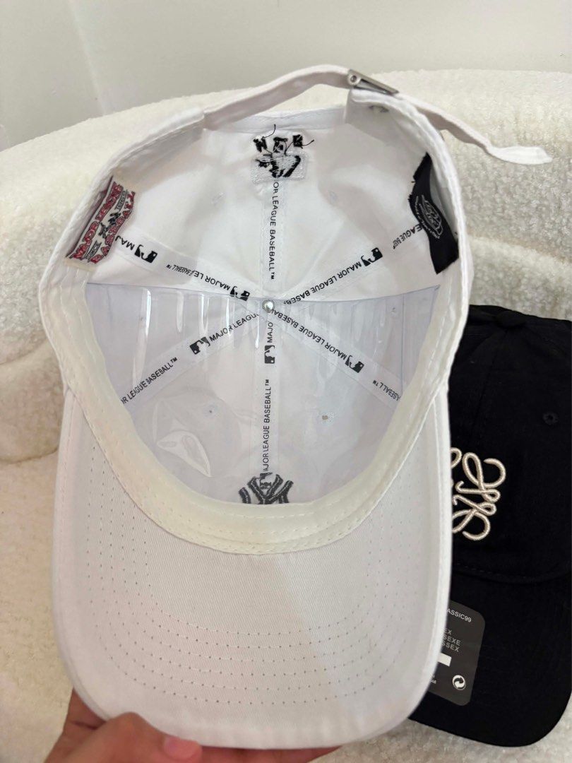 Loewe and MLB New York Yankees Caps (Category: Activewear) located in Makati City. Submitted by nixxx000 (Listing ID 1441599241, Image 2). Description: - Black Loewe baseball cap with adjustable strap - White New York Yankees MLB baseball cap with adjustable strap - Perfect for casual everyday wear - Both caps are adjustable for a comfortable fit.