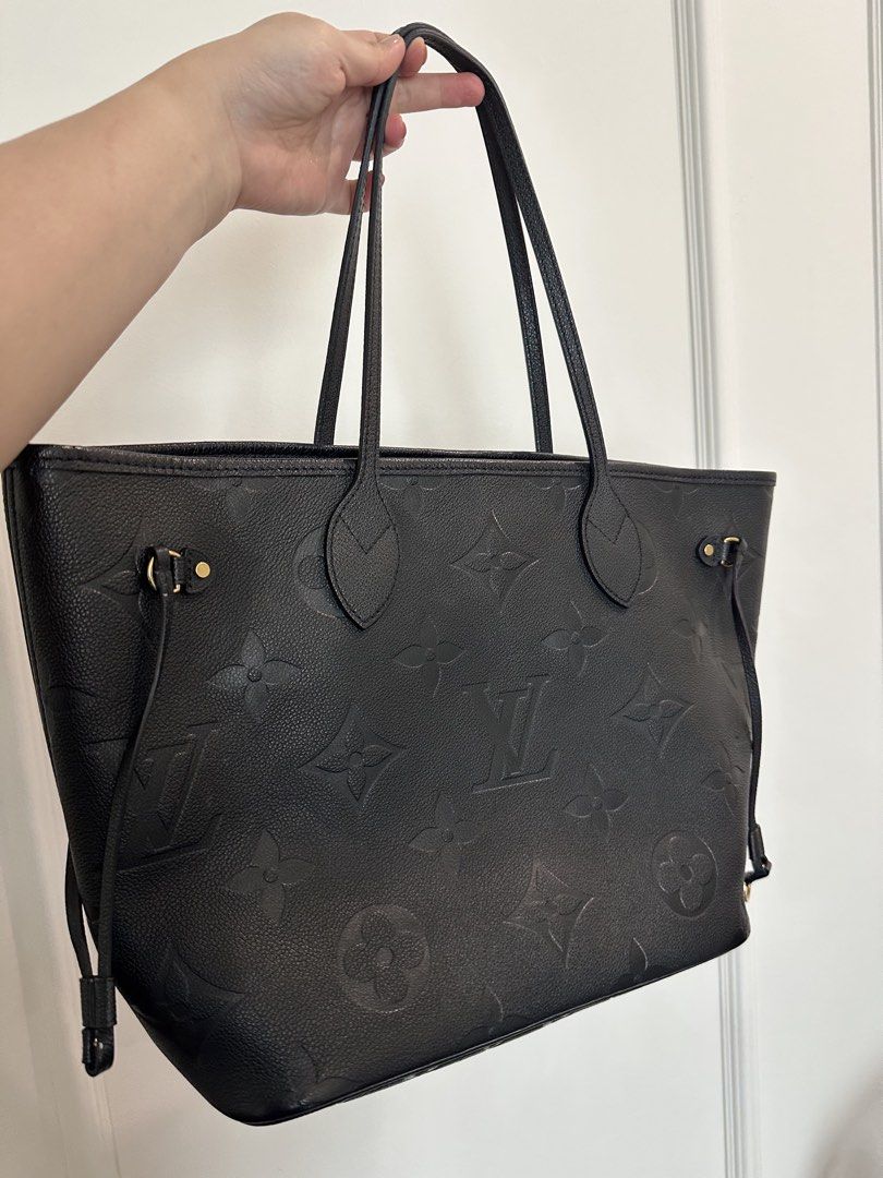 Authentic Louis Vuitton Black Monogram Empreinte Neverfull MM Tote Bag (Category: Luxury Bags & Wallets) located in Pasig City. Submitted by 2ndluxe (Listing ID 1441591896, Image 1). Description: - Authentic Louis Vuitton tote bag - Color: Black - Material: Monogram Empreinte leather - Features: Spacious interior, comfortable shoulder straps - Ideal for: Everyday use, travel - Includes: Original dust bag, Box -Used less than 5x -Bought from LV Si