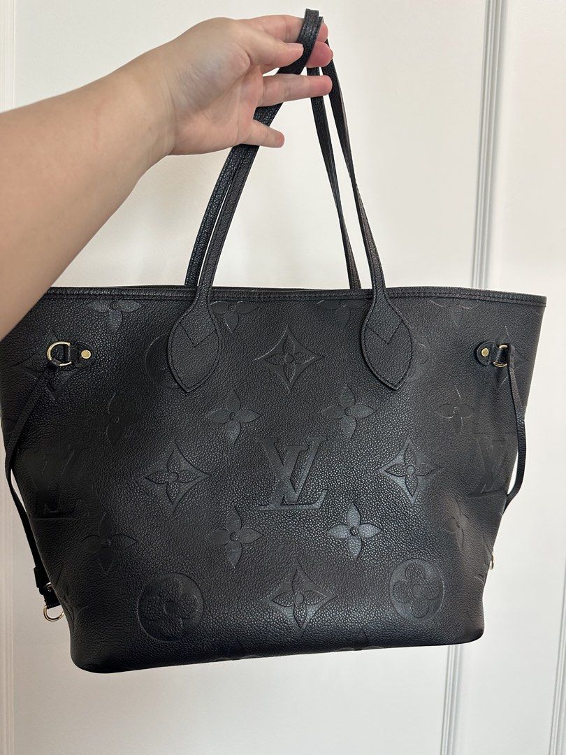 Authentic Louis Vuitton Black Monogram Empreinte Neverfull MM Tote Bag (Category: Luxury Bags & Wallets) located in Pasig City. Submitted by 2ndluxe (Listing ID 1441591896, Image 2). Description: - Authentic Louis Vuitton tote bag - Color: Black - Material: Monogram Empreinte leather - Features: Spacious interior, comfortable shoulder straps - Ideal for: Everyday use, travel - Includes: Original dust bag, Box -Used less than 5x -Bought from LV Si