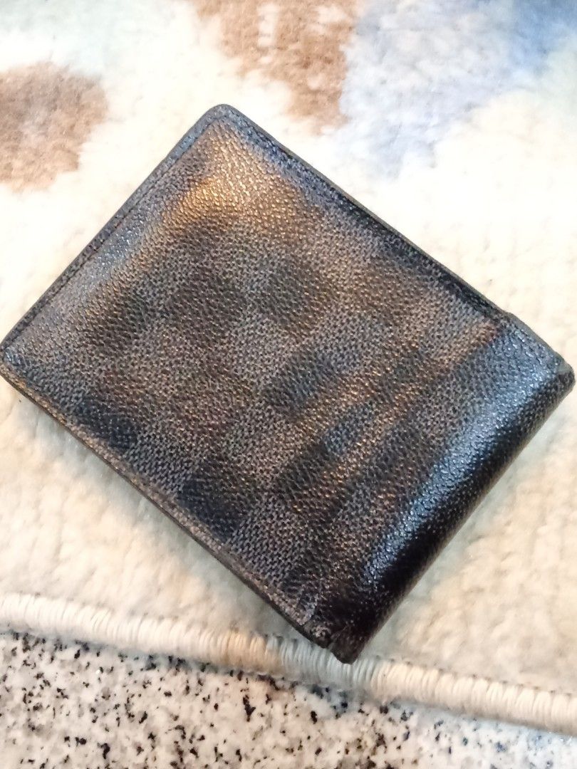 Louis Vuitton Damier Graphite Bifold Wallet (Category: Luxury Bags & Wallets) located in Manila. Submitted by christoph17 (Listing ID 1441679385, Image 2). Description: - Authentic Louis Vuitton Wallet - Damier Graphite Canvas - Bifold Style - Multiple Card Slots & Bill Compartment - Made in France - Functional and stylish accessory.
