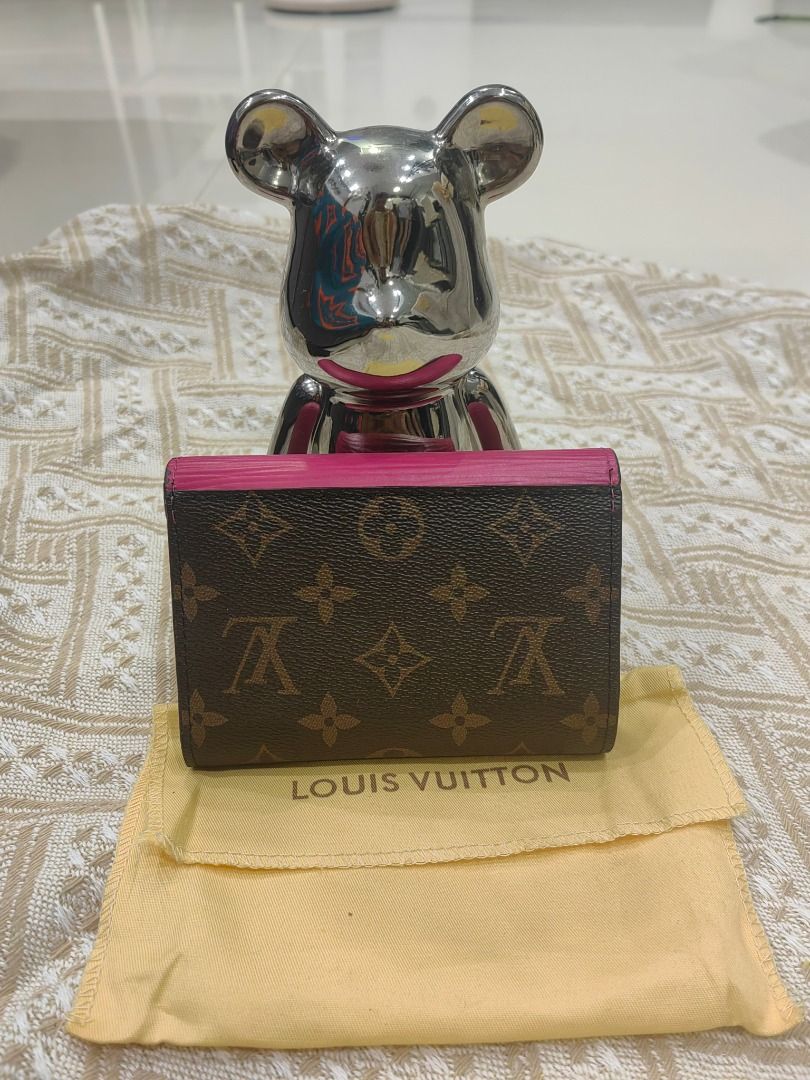 Louis Vuitton Monogram Canvas Pink Interior Bifold Wallet (Category: Luxury Bags & Wallets) located in Cebu City. Submitted by erlacoleccion (Listing ID 1441749154, Image 2). Description: - Monogram bifold wallet - Vibrant pink interior - Multiple card slots - Coin pocket - Compact and stylish design - Made in France - Dust bag included.