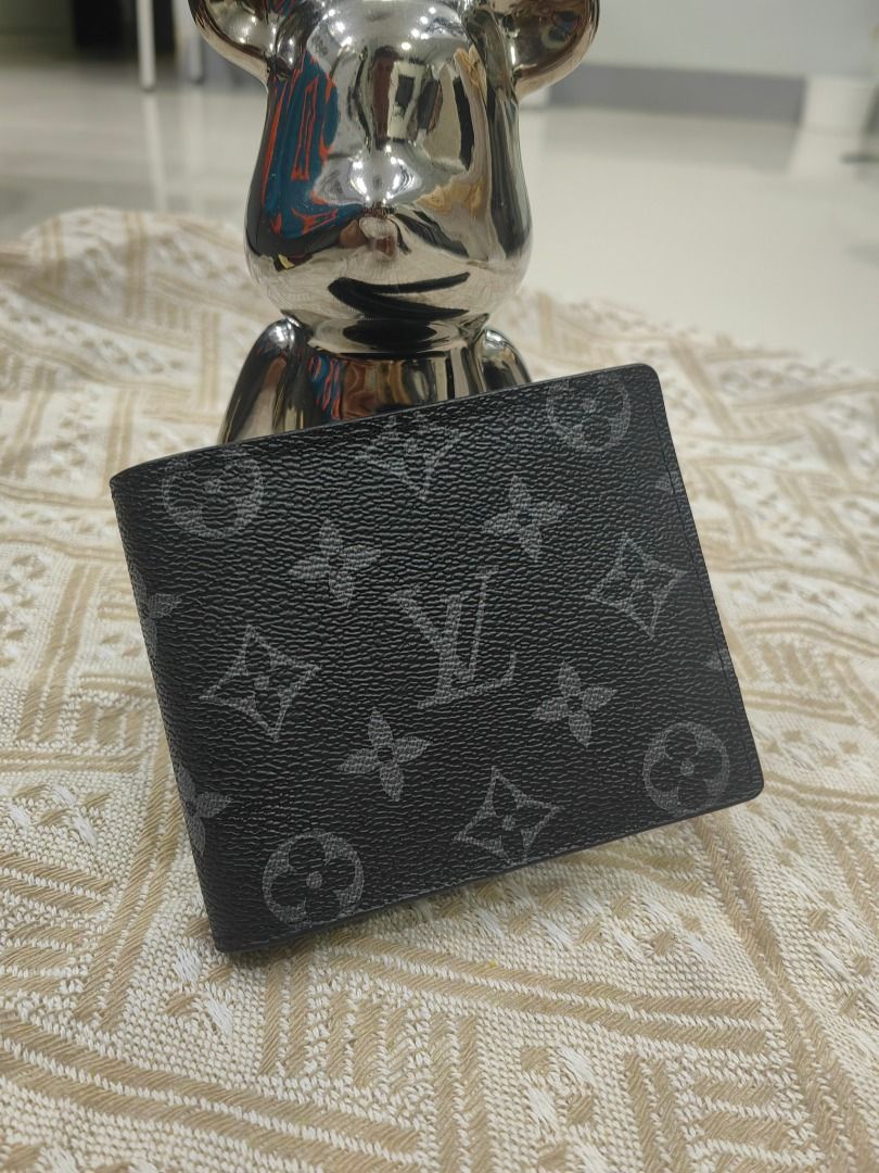Louis Vuitton Monogram Eclipse Bifold Wallet (Category: Luxury Bags & Wallets) located in Cebu City. Submitted by erlacoleccion (Listing ID 1441749887, Image 1). Description: - Louis Vuitton Wallet - Monogram Eclipse Canvas - Bifold Style - Multiple Card Slots - Bill Compartment - Black and Grey Colorway - Clean Interior - Ideal for Everyday Use.