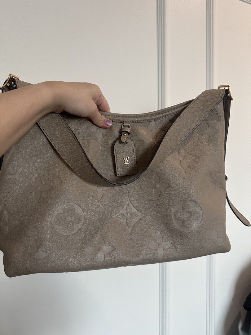 Authentic Louis Vuitton Monogram Empreinte Hobo Bag Taupe (Category: Luxury Bags & Wallets) located in Pasig City. Submitted by 2ndluxe (Listing ID 1441589823, Image 1). Description: - Authentic Louis Vuitton Hobo Bag - Color: Taupe - Pattern: Embossed Monogram Empreinte - Material: Soft, supple leather - Hardware: Gold details - Strap: Adjustable shoulder strap - Interior: Spacious - Ideal for: Everyday use - Includes: Original dust bag -Used on