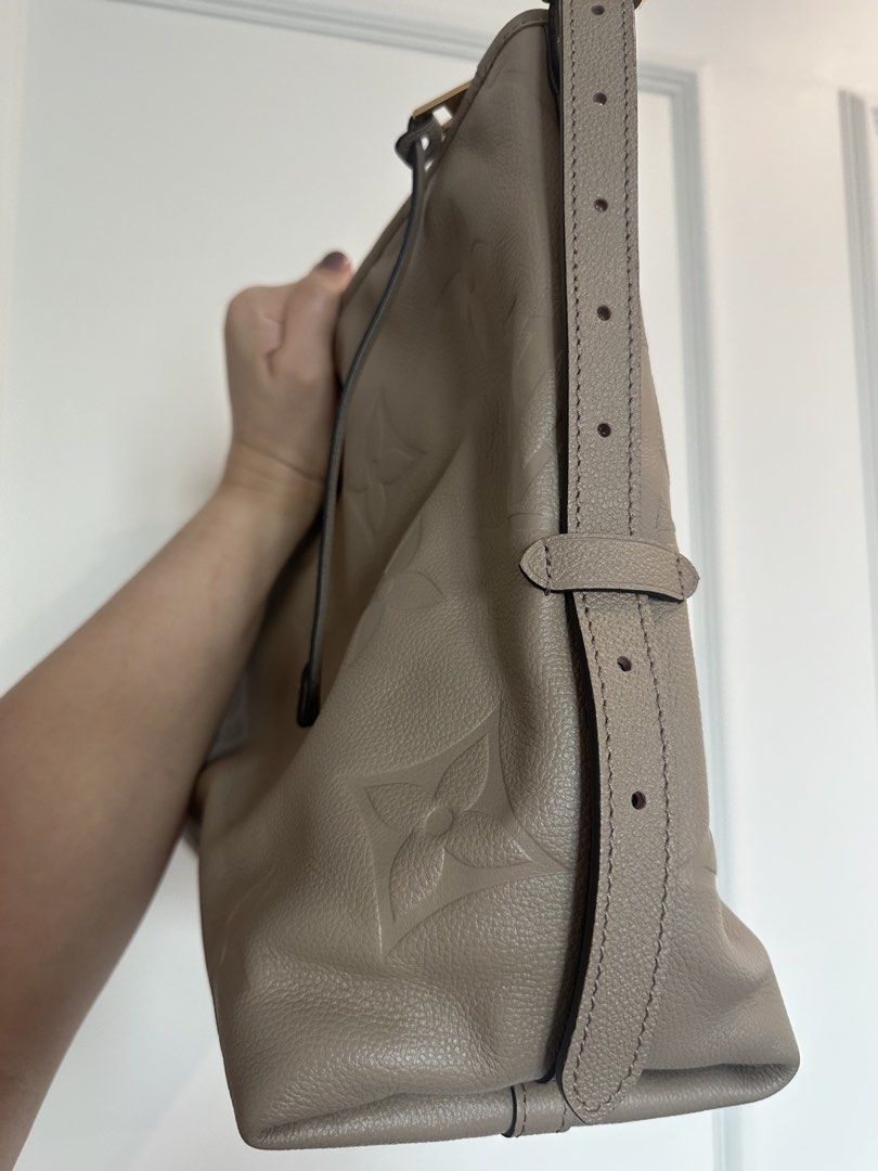 Authentic Louis Vuitton Monogram Empreinte Hobo Bag Taupe (Category: Luxury Bags & Wallets) located in Pasig City. Submitted by 2ndluxe (Listing ID 1441589823, Image 3). Description: - Authentic Louis Vuitton Hobo Bag - Color: Taupe - Pattern: Embossed Monogram Empreinte - Material: Soft, supple leather - Hardware: Gold details - Strap: Adjustable shoulder strap - Interior: Spacious - Ideal for: Everyday use - Includes: Original dust bag -Used on