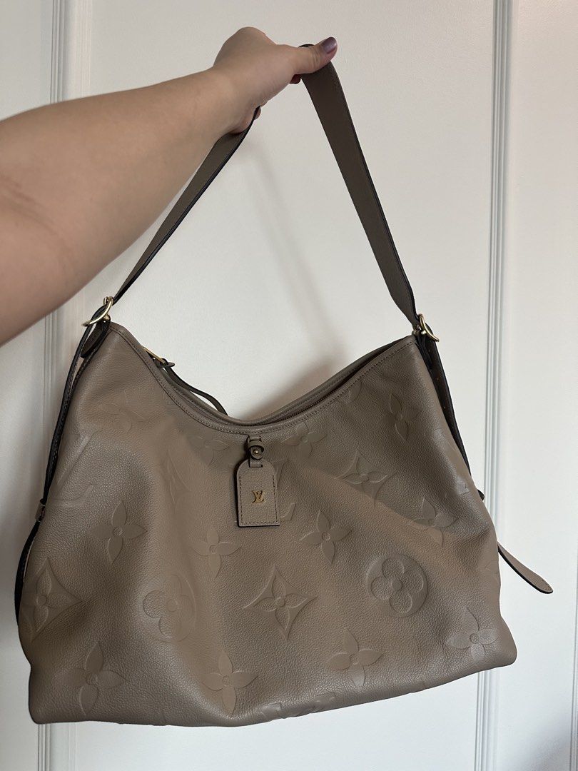 Authentic Louis Vuitton Monogram Empreinte Hobo Bag Taupe (Category: Luxury Bags & Wallets) located in Pasig City. Submitted by 2ndluxe (Listing ID 1441589823, Image 2). Description: - Authentic Louis Vuitton Hobo Bag - Color: Taupe - Pattern: Embossed Monogram Empreinte - Material: Soft, supple leather - Hardware: Gold details - Strap: Adjustable shoulder strap - Interior: Spacious - Ideal for: Everyday use - Includes: Original dust bag -Used on