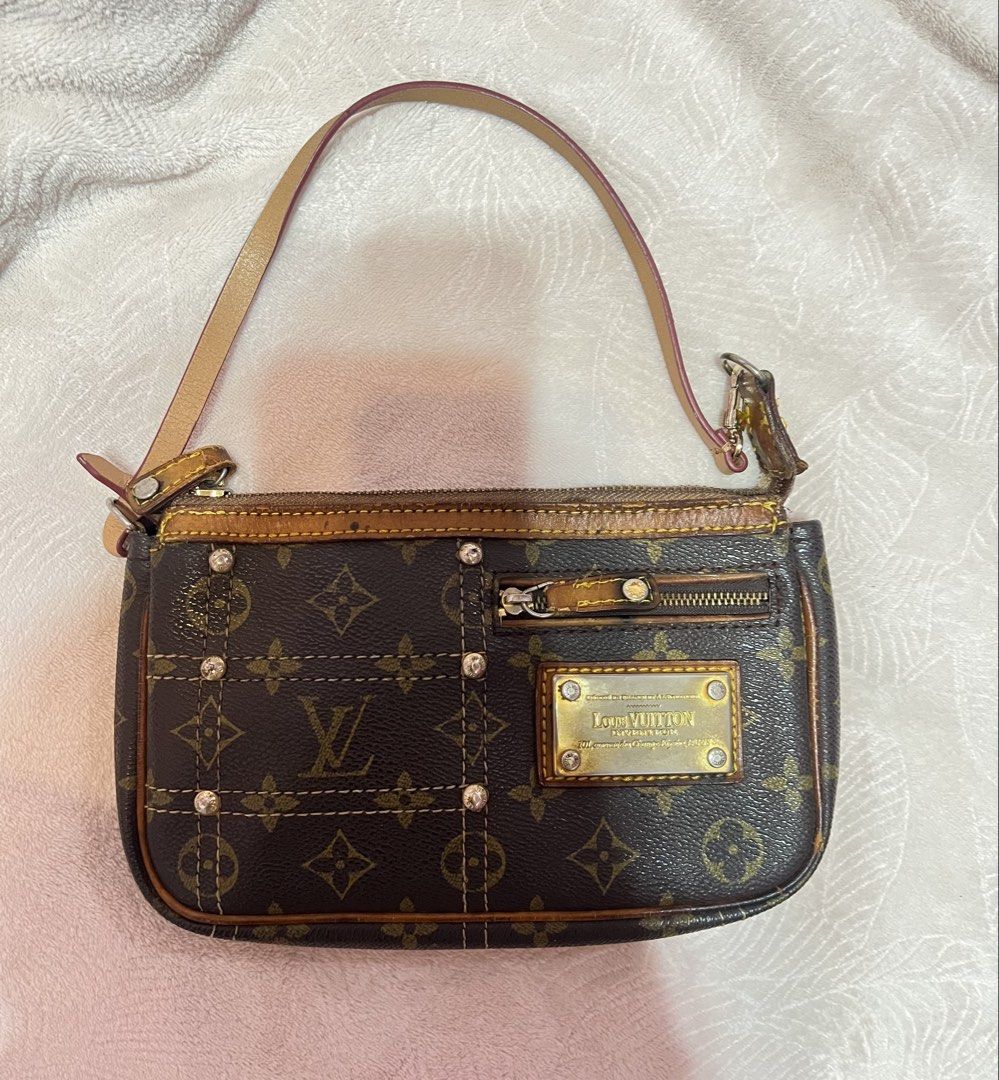LV rare vintage monogram riveting pochette 2007 (Category: Luxury Bags & Wallets) located in Davao. Submitted by halohalohunter (Listing ID 1441685754, Image 1). Description: LV vintage monogram riveting pochette 2007 rare- limited edition seasonal piece archival price is negotiable -needs some fixing, cleaning and slight restoration on the plates, trims and stitchings -strap is a replacement strap already -very vintage - Classic Monogram Canvas 