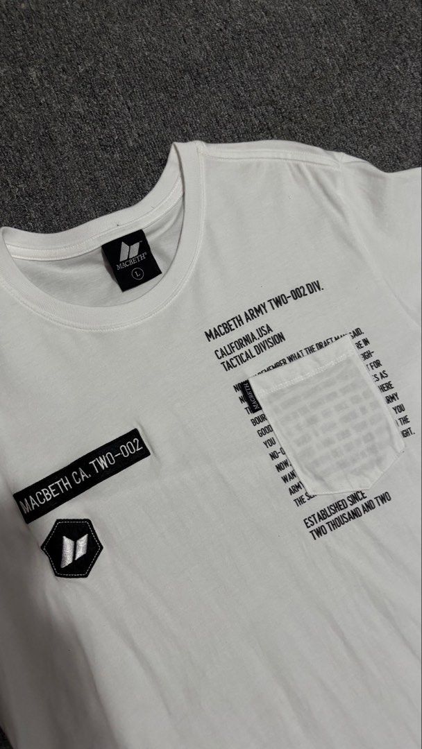 Macbeth Army Tactical Division White T-Shirt (Category: Tshirts & Polo Shirts ) located in Manila. Submitted by pastlovd (Listing ID 1441658585, Image 2). Description: - White Macbeth t-shirt - Size: Large (L) - Features 'Macbeth Army Two-002 Div.' and 'California USA Tactical Division' graphics - Includes a pocket detail with text - Ideal for casual wear - Complete tags, Necktag and Washtag - Condition: Flawless - 27.5 x 19.5 .