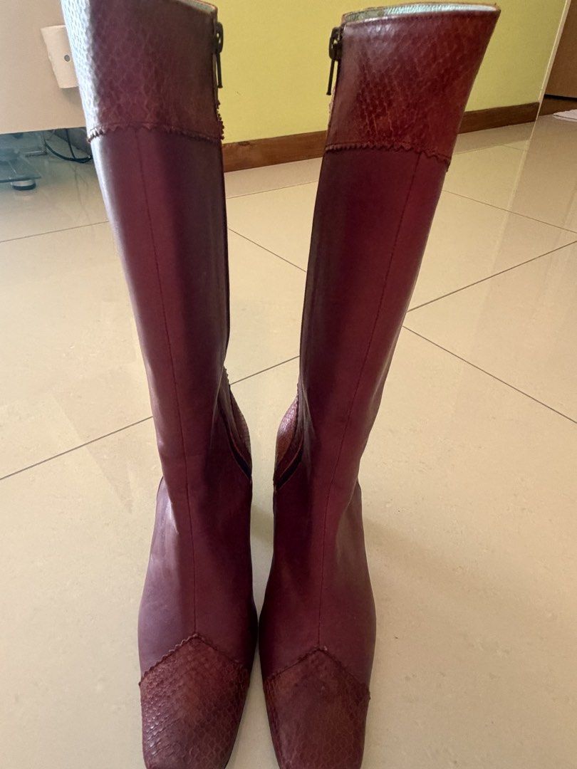 Made in Japan size 23.5 Women's Burgundy Leather below Knee Boots (Category: Boots) located in Singapore. Submitted by happygolucky123123 (Listing ID 1441693144, Image 2). Description: - Burgundy leather below knee boots - Side zipper closure - Block heel - Stylish and versatile for various outfits - Perfect for dressing up or down.