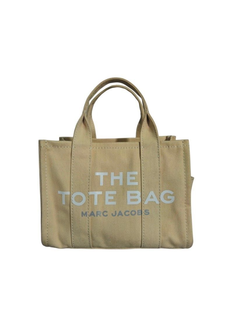 Marc Jacobs The Tote Bag in Canvas (Category: Luxury Bags & Wallets) located in Quezon City. Submitted by kirstenbella (Listing ID 1441678507, Image 1). Description: 💯Authentic The Tote Bag by Marc Jacobs - Beige in thick Canvas material - Top handle with adjustable Wide strap - Closure: Zipper - Classic logo print on the front - Features brand name print - Interior: Pocket and tag - Spacious and washable, ideal for everyday use - Over all NO Is