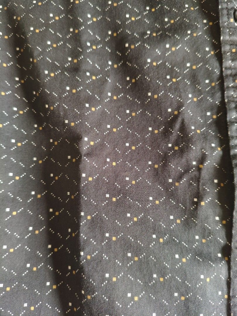Men's Short Sleeve Button-Up Shirt Size S (Category: Tshirts & Polo Shirts ) located in Caloocan City. Submitted by newgem-9649 (Listing ID 1441603181, Image 2). Description: - Black short sleeve button-up shirt - Features a subtle geometric pattern with white and yellow dots - Classic collar and button front - Perfect for casual wear or dressing up - Sharp and versatile style.