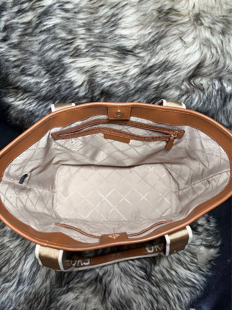 Michael Michael Kors Maeve monogram-print tote bag (Category: Tote Bags) located in Muntinlupa City. Submitted by charizze21 (Listing ID 1438648482, Image 3). Description: AUTHENTIC MK PRELOVED FROM US A chocolate brown monogram pattern logo plaque two rounded top handles concealed magnetic fastening internal zip-fastening pocket Product measurements Depth: 16 cm (6.29 in) Handle: 24 cm (9.44 in) Width: 43 cm (16.92 in) Height: 30 cm (11.81 in).