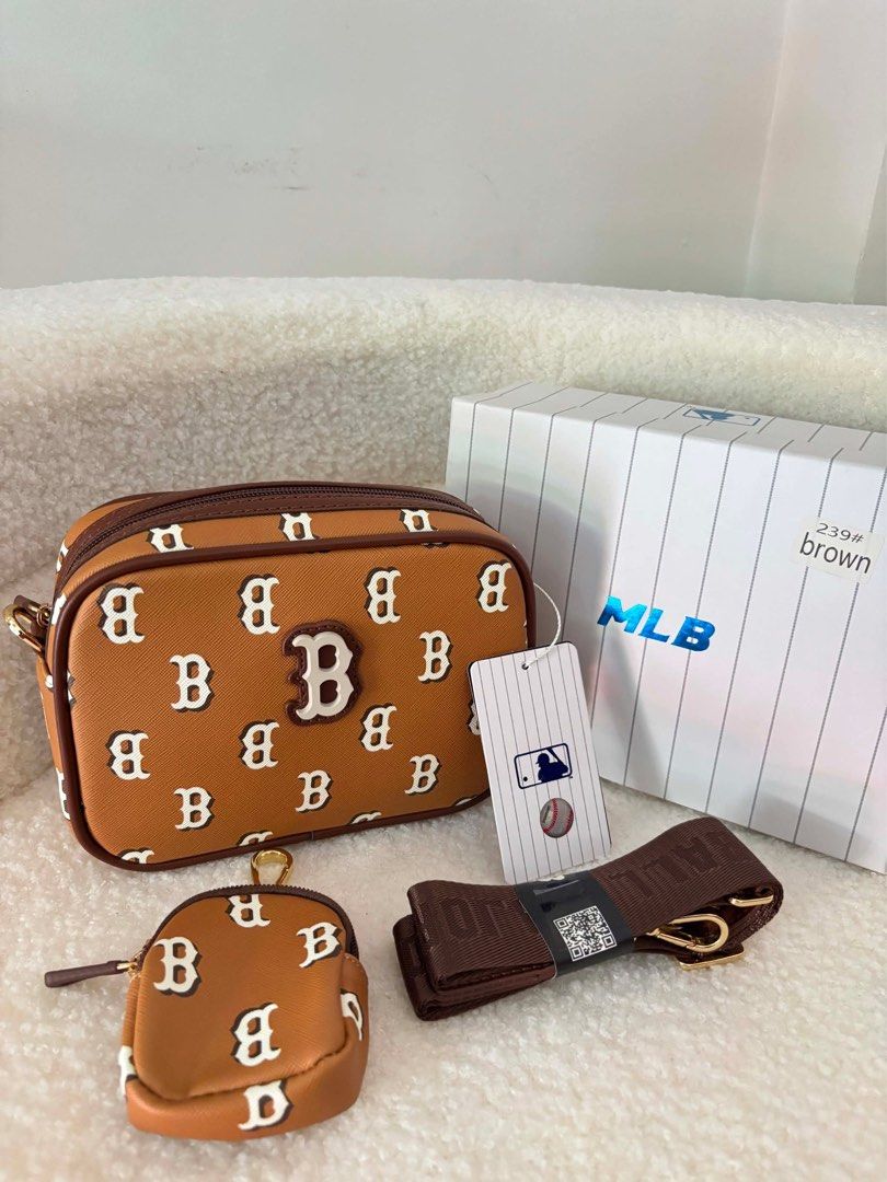 MLB Boston Red Sox Monogram Crossbody Bag Brown (Category: Cross-body Bags) located in Makati City. Submitted by nixxx000 (Listing ID 1441598542, Image 2). Description: - Brown MLB crossbody bag - Features Boston Red Sox monogram print - Comes with a matching coin pouch - Adjustable strap for comfort - Original box included - Ideal for everyday use or travel.