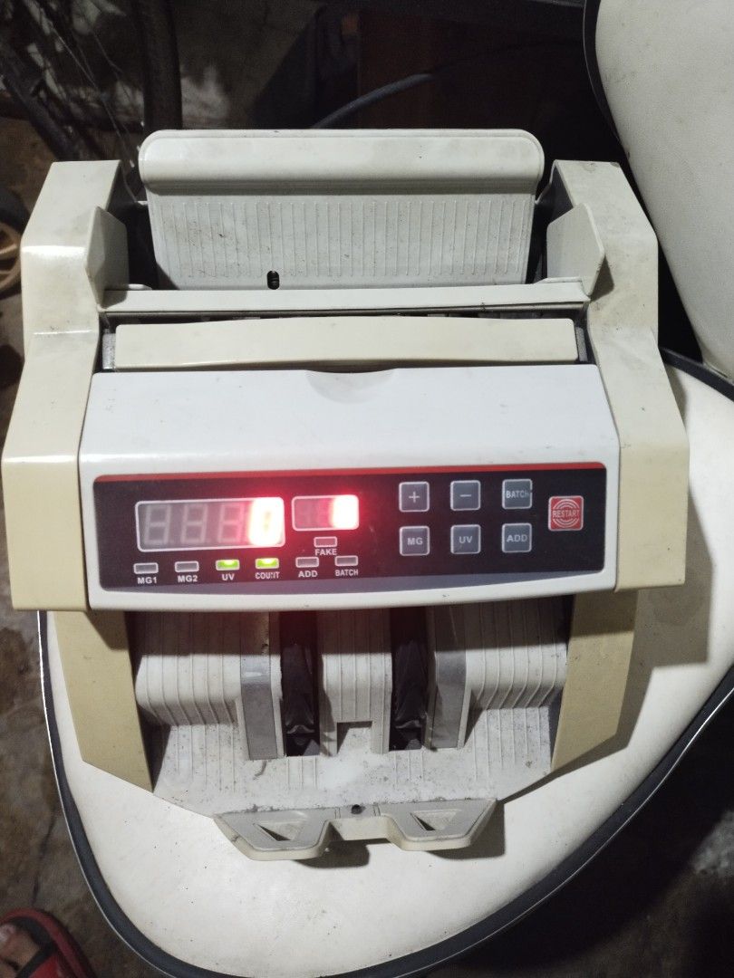 Money Counter Machine (Category: Office & Business Technology) located in Pasay City. Submitted by dheo27 (Listing ID 1441611408, Image 1). Description: - Used money counting machine in good working condition. - Equipped with UV detection for authenticity. - Offers add count and batch count features. - Ideal for business or personal cash handling. - Selling because it's no longer required..
