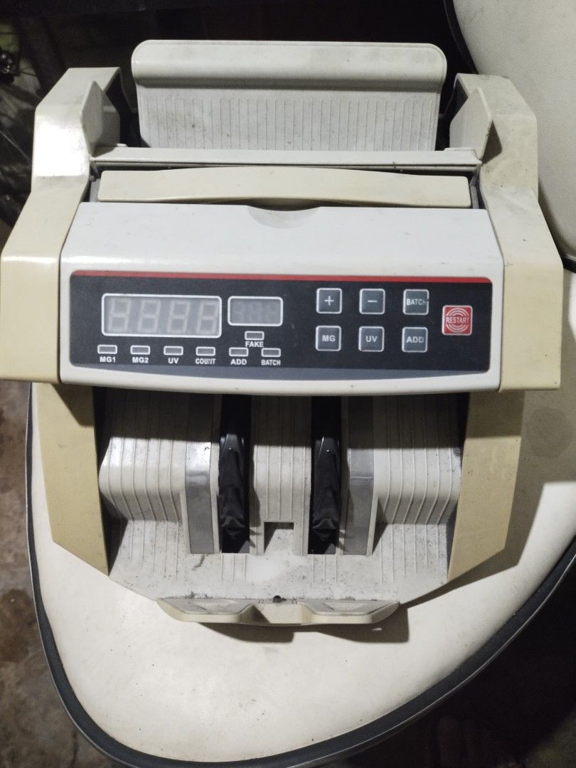Money Counter Machine (Category: Office & Business Technology) located in Pasay City. Submitted by dheo27 (Listing ID 1441611408, Image 2). Description: - Used money counting machine in good working condition. - Equipped with UV detection for authenticity. - Offers add count and batch count features. - Ideal for business or personal cash handling. - Selling because it's no longer required..