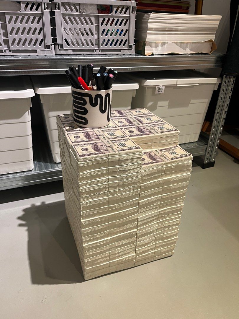 Money Stack Side Table / Stool (Category: Tables & Sets) located in Singapore. Submitted by keemcandy (Listing ID 1441715041, Image 1). Description: - Unique side table designed like stacks of US dollar bills. - Can be used as a stool or a decorative piece. - Bought from Taobao in 2025. Buyer to pick up at premise (Chinatown) or to self-arrange for courier to pick it up..