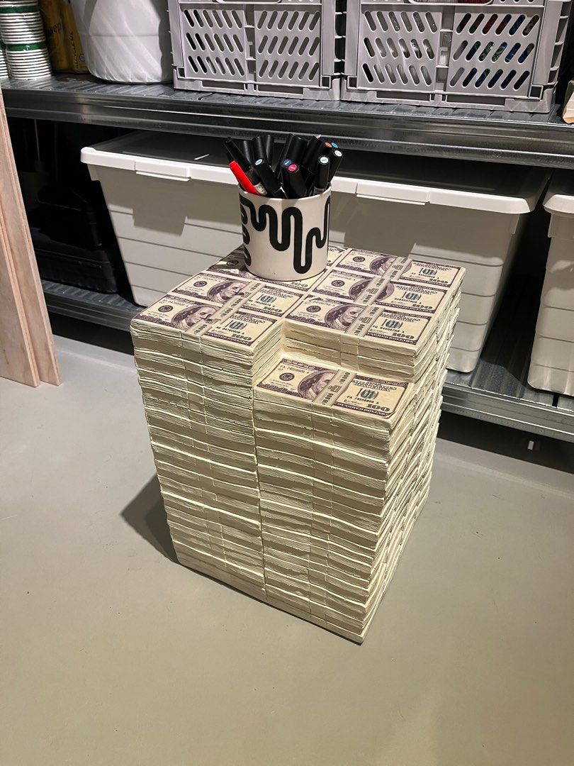 Money Stack Side Table / Stool (Category: Tables & Sets) located in Singapore. Submitted by keemcandy (Listing ID 1441715041, Image 2). Description: - Unique side table designed like stacks of US dollar bills. - Can be used as a stool or a decorative piece. - Bought from Taobao in 2025. Buyer to pick up at premise (Chinatown) or to self-arrange for courier to pick it up..