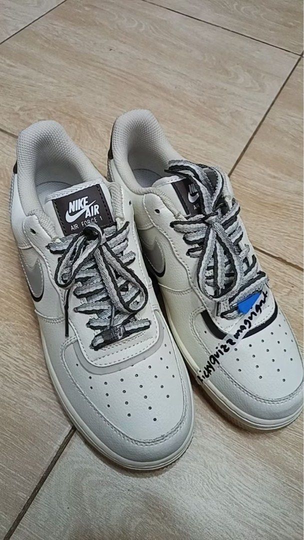 Nike Air Force 1 Low White/Grey Sneakers (Category: Sneakers) located in Abulug. Submitted by xaraeus (Listing ID 1441619647, Image 3). Description: - Classic Nike Air Force 1s - White leather with grey accents - Dark blue and translucent soles - Great for everyday wear -Split Sole.