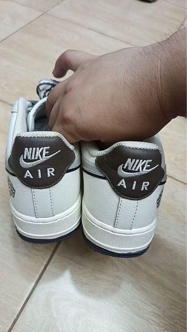 Nike Air Force 1 Low White/Grey Sneakers (Category: Sneakers) located in Abulug. Submitted by xaraeus (Listing ID 1441619647, Image 2). Description: - Classic Nike Air Force 1s - White leather with grey accents - Dark blue and translucent soles - Great for everyday wear -Split Sole.