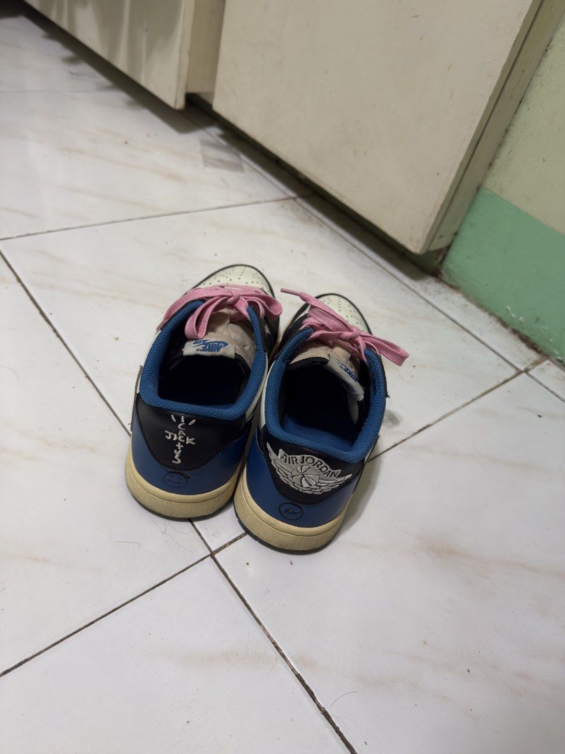 Nike Air Jordan 1 Low Travis Scott (Category: Sneakers) located in Manila. Submitted by calmtiger-6d6d (Listing ID 1441776376, Image 2). Description: - Travis Scott Jordan 1 Lows - Colorway: Cream, black, and blue - Includes pink laces - Minor creasing on toe box - Visible wear on soles - Still has significant wear left.
