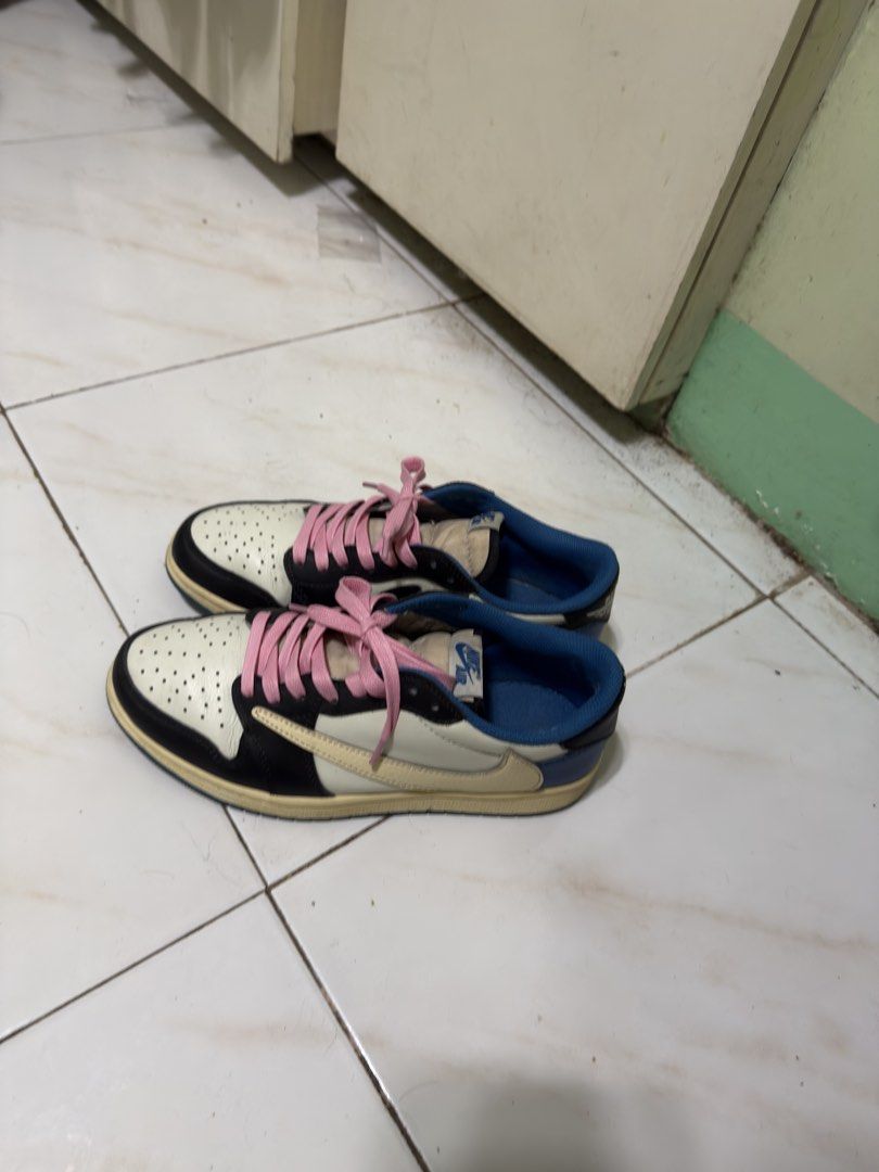 Nike Air Jordan 1 Low Travis Scott (Category: Sneakers) located in Manila. Submitted by calmtiger-6d6d (Listing ID 1441776376, Image 1). Description: - Travis Scott Jordan 1 Lows - Colorway: Cream, black, and blue - Includes pink laces - Minor creasing on toe box - Visible wear on soles - Still has significant wear left.