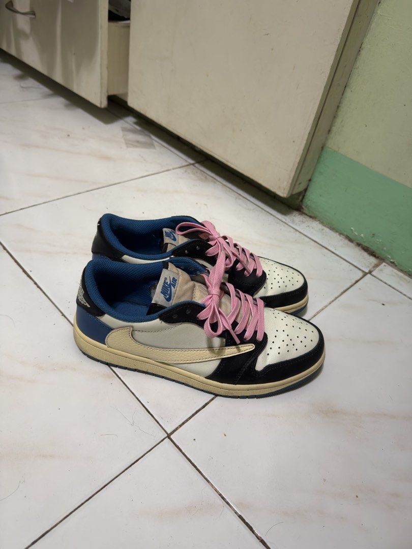 Nike Air Jordan 1 Low Travis Scott (Category: Sneakers) located in Manila. Submitted by calmtiger-6d6d (Listing ID 1441776376, Image 3). Description: - Travis Scott Jordan 1 Lows - Colorway: Cream, black, and blue - Includes pink laces - Minor creasing on toe box - Visible wear on soles - Still has significant wear left.