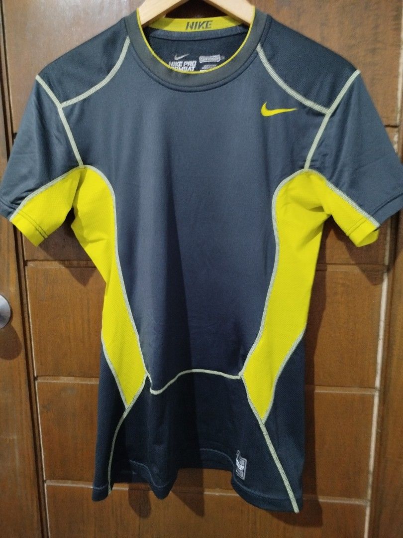 Nike Pro Combat Dri-Fit Compression T-shirt (Category: Activewear) located in Dipolog. Submitted by x1987 (Listing ID 1441691310, Image 1). Description: - Grey and yellow Nike Pro Combat Dri-Fit compression t-shirt - Short sleeves - Ideal for workouts and sports - Breathable mesh panels on the back - Comfortable and secure fit.