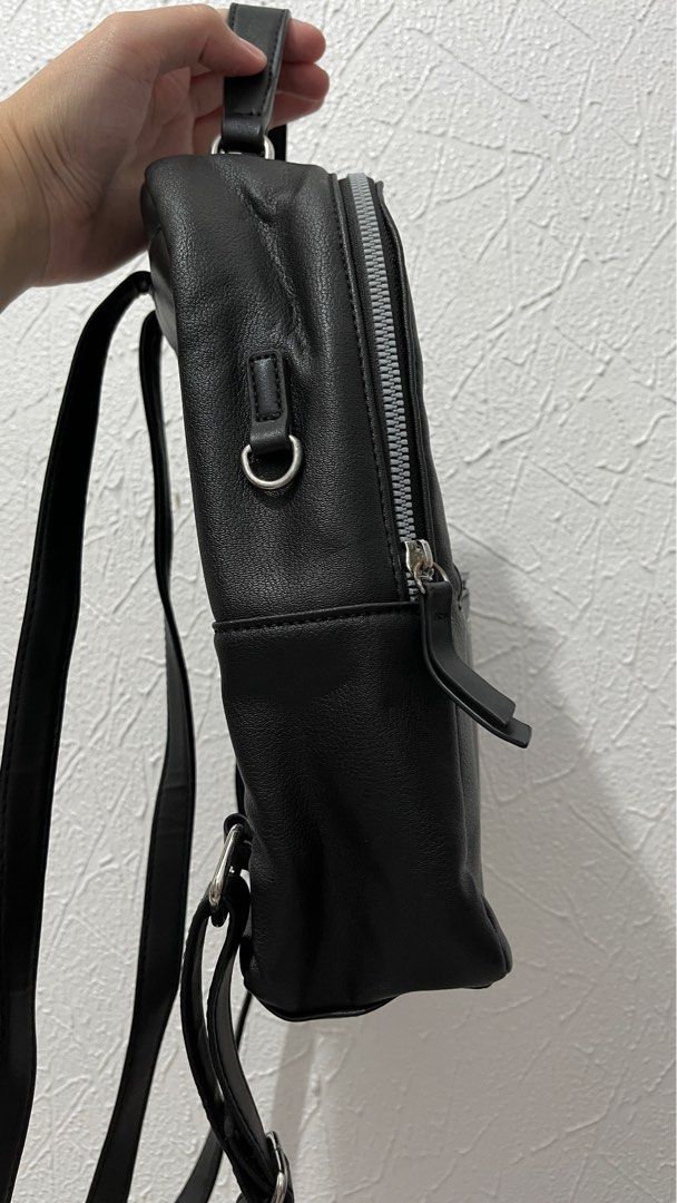 Nine West Black Faux Leather Mini Backpack (Category: Backpacks) located in Naga. Submitted by lilycheedeclutter (Listing ID 1441741744, Image 3). Description: ‼️ HAS FLAW: Front pocket zipper (check last pic for reference) ‼️ L: 9” W: 3.3” H: 11” CAN FIT IPAD 11TH GEN .