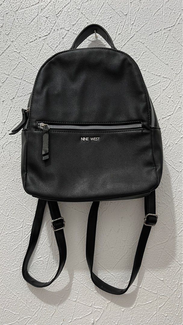 Nine West Black Faux Leather Mini Backpack (Category: Backpacks) located in Naga. Submitted by lilycheedeclutter (Listing ID 1441741744, Image 1). Description: ‼️ HAS FLAW: Front pocket zipper (check last pic for reference) ‼️ L: 9” W: 3.3” H: 11” CAN FIT IPAD 11TH GEN .