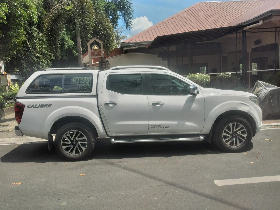 Nissan Navara EL 2.5L Manual (Category: Used Cars) located in Quezon City. Submitted by foxsquaredeals (Listing ID 1441609475, Image 2). Description: FOR SALE: Nissan Navarra 2.5L EL (2019) •Manual Transmission •Diesel Engine •Mileage: ~71,000km •Color: Alpine White •Wednesday Coding •Registered and renewed until June 8, 2026 •Comes with canopy •New wheels & battery •Has minor dents & scratches •Wear and tear of interior leather seats • Price: ₱7