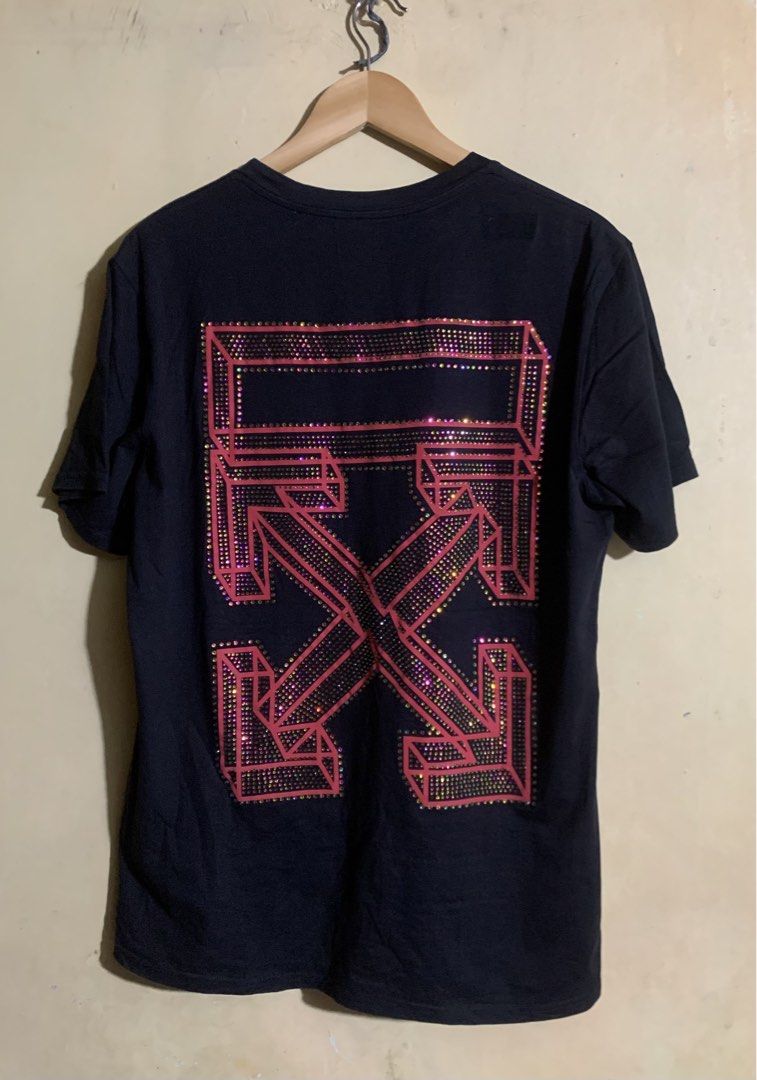 OFF-WHITE "MAIN LABEL" 2013 Black T-Shirt (Category: Tshirts & Polo Shirts ) located in Legazpi City. Submitted by casanibrah33153 (Listing ID 1441697354, Image 2). Description: - Authentic 2013 Black OFF-WHITE T-Shirt - Front: 'MAIN LABEL' graphic with red '6' and sparkling details - Back: Iconic OFF-WHITE arrow logo embellished with rhinestones - Made in Portugal - Perfect addition to any streetwear collection.