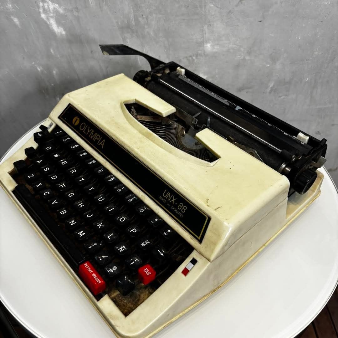 Olympia UNX-88 Typewriter Made in Germany (Category: Office & Business Technology) located in Valenzuela. Submitted by upcycle_things (Listing ID 1441590796, Image 3). Description: - Olympia UNX-88 mechanical typewriter - Made in Germany - Black keys with white lettering - Red TAB and REPEAT SPACER keys - Shows some signs of wear and dust - Ideal for collectors or display.