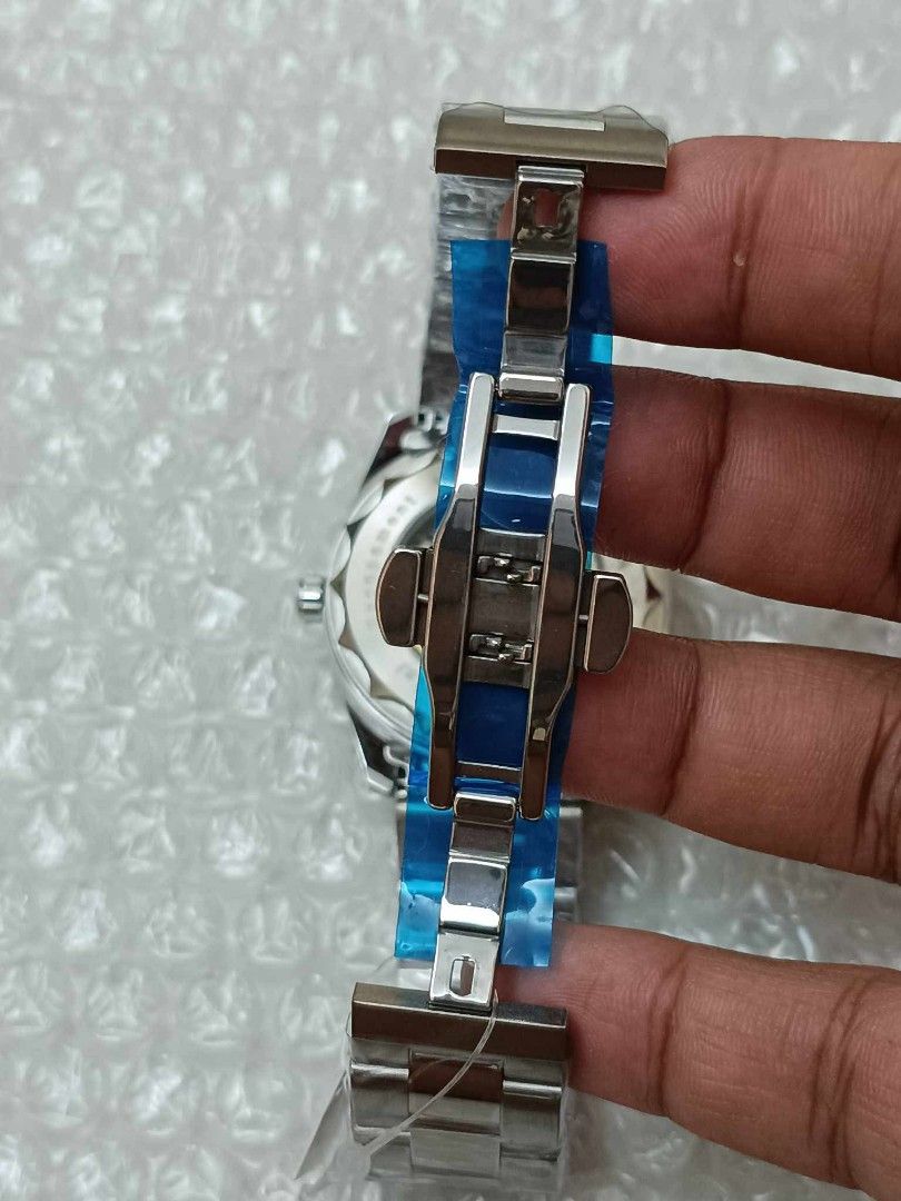 Omega Constellation Co-Axial World Timer Automatic Men's Watch (Category: Men's Watches) located in Manila. Submitted by crustynico23 (Listing ID 1441603831, Image 3). Description: - Omega Constellation Co-Axial World Timer - Automatic movement with exhibition case back - Stainless steel bracelet with deployant clasp - Blue dial featuring city markers for world time - Includes original box.