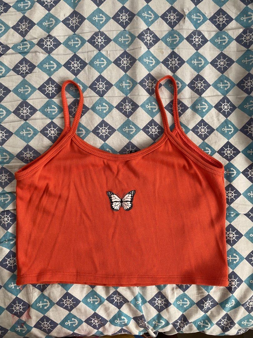 Orange Butterfly Ribbed Crop Top / Cami Top (Category: Sleeveless) located in Manila. Submitted by cosmicforest.84e653 (Listing ID 1441624237, Image 2). Description: Description: Ribbed Fabric and very stretchable Size: XS-M Measurement: L-7.5 inch, W-13inch Condition: 10/10, no flaws and very good condition. RFS (Reason for Selling): Decluttering / Hindi na nagagamit. 📌 Rule: Valid for 24-48 hours reservation only. No rush shipping. Return/exch