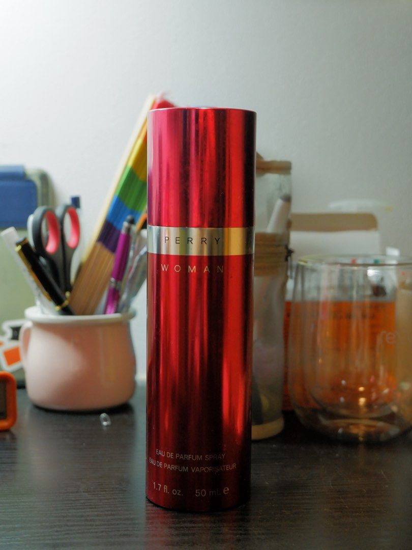 Perry Woman Eau de Parfum Spray 50ml (Category: Fragrance & Deodorants) located in Manila. Submitted by labarcial98218 (Listing ID 1441686308, Image 2). Description: - Perry Woman Eau de Parfum Spray - 50ml bottle - Comes in a shiny red metallic canister - Perfume color: Warm amber - Scent profile: Great for everyday wear - Reason for selling: Too many perfumes -About 5 ml of the product already used .
