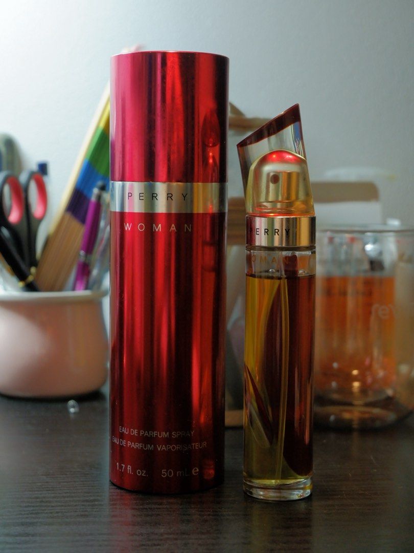 Perry Woman Eau de Parfum Spray 50ml (Category: Fragrance & Deodorants) located in Manila. Submitted by labarcial98218 (Listing ID 1441686308, Image 1). Description: - Perry Woman Eau de Parfum Spray - 50ml bottle - Comes in a shiny red metallic canister - Perfume color: Warm amber - Scent profile: Great for everyday wear - Reason for selling: Too many perfumes -About 5 ml of the product already used .