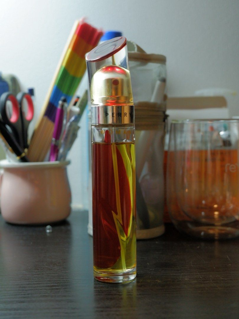 Perry Woman Eau de Parfum Spray 50ml (Category: Fragrance & Deodorants) located in Manila. Submitted by labarcial98218 (Listing ID 1441686308, Image 3). Description: - Perry Woman Eau de Parfum Spray - 50ml bottle - Comes in a shiny red metallic canister - Perfume color: Warm amber - Scent profile: Great for everyday wear - Reason for selling: Too many perfumes -About 5 ml of the product already used .