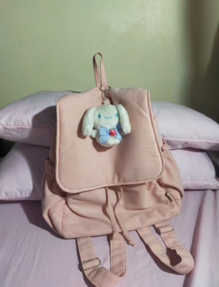 Pink Corduroy Drawstring Backpack (Category: Backpacks) located in Bulacan. Submitted by meisharet (Listing ID 1441697837, Image 1). Description: for sale‼️ ₱199 + sf (+50 if kasama cinnamorolll) RFS: shoulder bags na bet ko hahaha minsan ko lang nagamit nung first sem originally bought it for ₱473! - padded compartment - kasya 22oz tumbler sa loob and a4 files - need i-bend yellow paper sa loob.