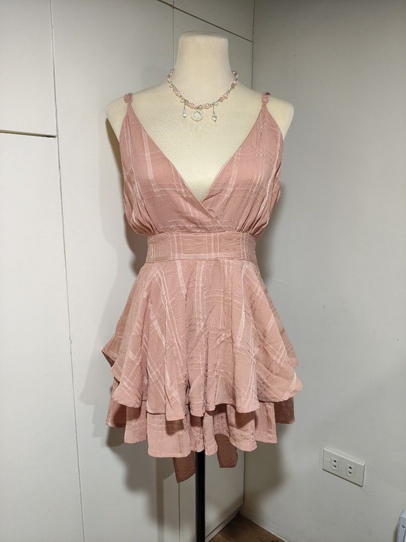 Pink Plaid Ruffle Mini Dress with Spaghetti Straps (Category: Dresses) located in Sison. Submitted by muchiberry (Listing ID 1441649917, Image 1). Description: size: m desc: loose shorts underneath, has a waist tie flaws: none overall condition: 10/10 mop: gcash, maribank, maya, bpi. NO COD disclaimer: these are PRELOVED clothes so manage your expectations. all noticeable flaws are listed, but there may be some that are missed. we can discuss mor
