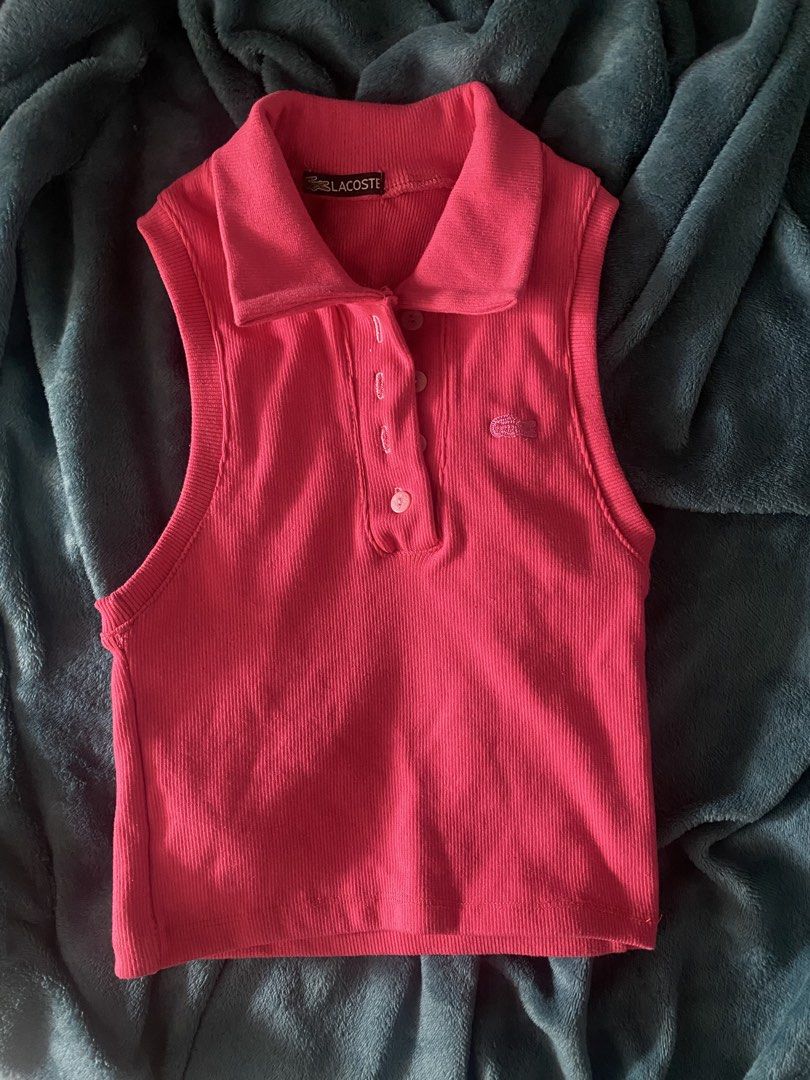 Pink Sleeveless Polo Crop Top (Category: Sleeveless) located in Leyte. Submitted by declutterthis__ (Listing ID 1441590670, Image 1). Description: - Cute pink Lacoste polo crop top - Sleeveless design - Ribbed texture - Classic Lacoste crocodile logo - Button-up neckline - Ideal for casual, sporty outfits - Pairs well with jeans or shorts.