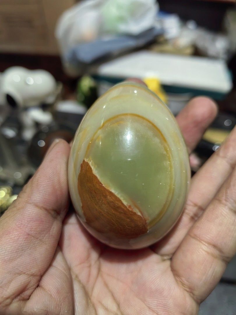 Polished Decorative Egg Green Onyx Marble (Category: Other Home Decor) located in Cebu City. Submitted by dudes_villanueva (Listing ID 1441622025, Image 2). Description: Polished Decorative Egg Green Onyx Marble 📌 Features distinct white and orange banding. 📌 Material: Natural Onyx Marble.Colors: Green, white, and orange/brown banded patterns. 📌 Finish: Polished to a smooth, glossy texture. 📌 Common Use: Decorative home or office. item. Heigh