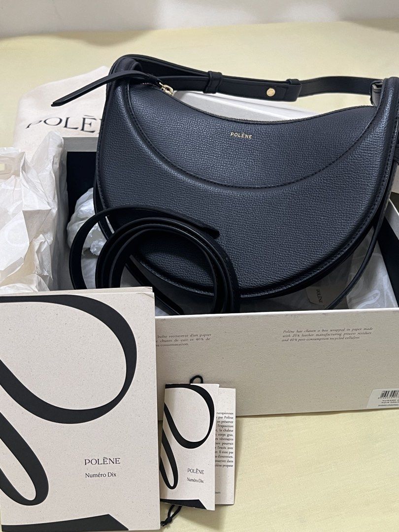 Polène Numéro Dix Black Grained Leather Shoulder Bag (Category: Luxury Bags & Wallets) located in Davao. Submitted by amdeclutterrr (Listing ID 1441660318, Image 2). Description: 2 yrs old bag na to sakin but rare lang nagagamit!! complete with box and extra straps na never nagamit. RFS need funds, bought for 26k bfore🥹🥹 Polène Numéro Dix bag - Color: Black - Material: Grained leather - Design: Crescent moon shape - Hardware: Gold - Includes: D