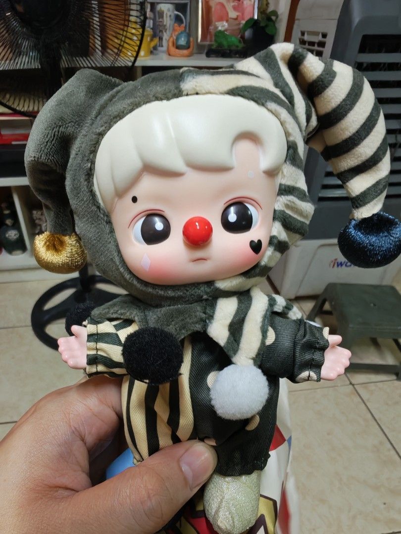 Popmart Hachipupu Why so serious? (Category: Plushies & Soft Toys) located in Caloocan City. Submitted by yaoizzy (Listing ID 1441626881, Image 1). Description: rfs - let go, decluttering - Adorable clown doll - Fun striped outfit and jester hat - Big eyes and red nose - Hand-sized (perfect for display or play) - Ideal for collectors or as a playful decoration - Ready for a new home!.