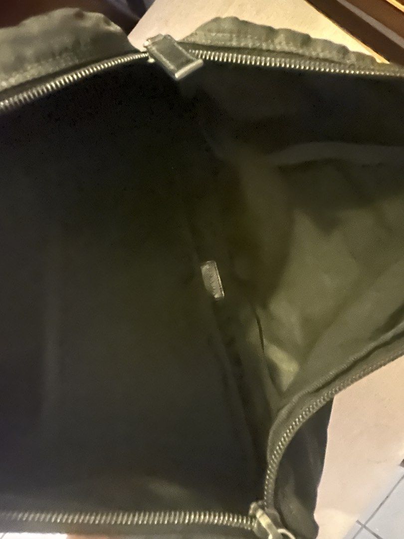 Prada Nylon Laptop Pouch Black (Category: Luxury Bags & Wallets) located in Pasig City. Submitted by preelovedby (Listing ID 1441712228, Image 3). Description: - Authentic Prada pouch - Black nylon material - Zipper closure - Ideal for organizing essentials or as a small clutch - Approximate dimensions: 10 inches x 6 inches.