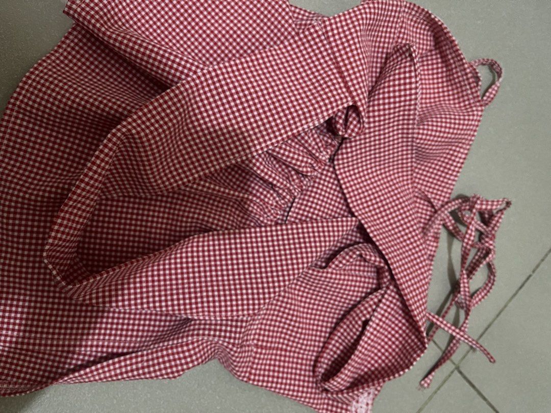Pre loved Red Gingham Tie-Strap babydoll top (Category: Sleeveless) located in Cabanatuan. Submitted by moncart (Listing ID 1441716418, Image 2). Description: - can fit small to medium bc self tie sya - only used twice mop: gcash/bank transfer mod: j&t or lbc 📍Cabanatuan City, Nueva Ecija.