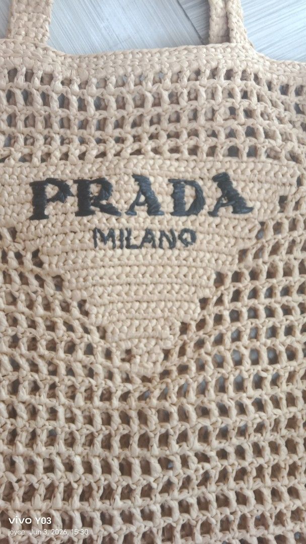 Preloved Prada Milano Crochet Tote Bag (Category: Luxury Bags & Wallets) located in Cabuyao City. Submitted by selections888 (Listing ID 1441717005, Image 3). Description: -preloved from Japan supplier -medium size -light yellow crochet tote bag - Features Prada Milano logo - Ideal for beach days or casual outings - Stylish and airy open-knit design - Crocheted handles - Roomy interior for essentials .