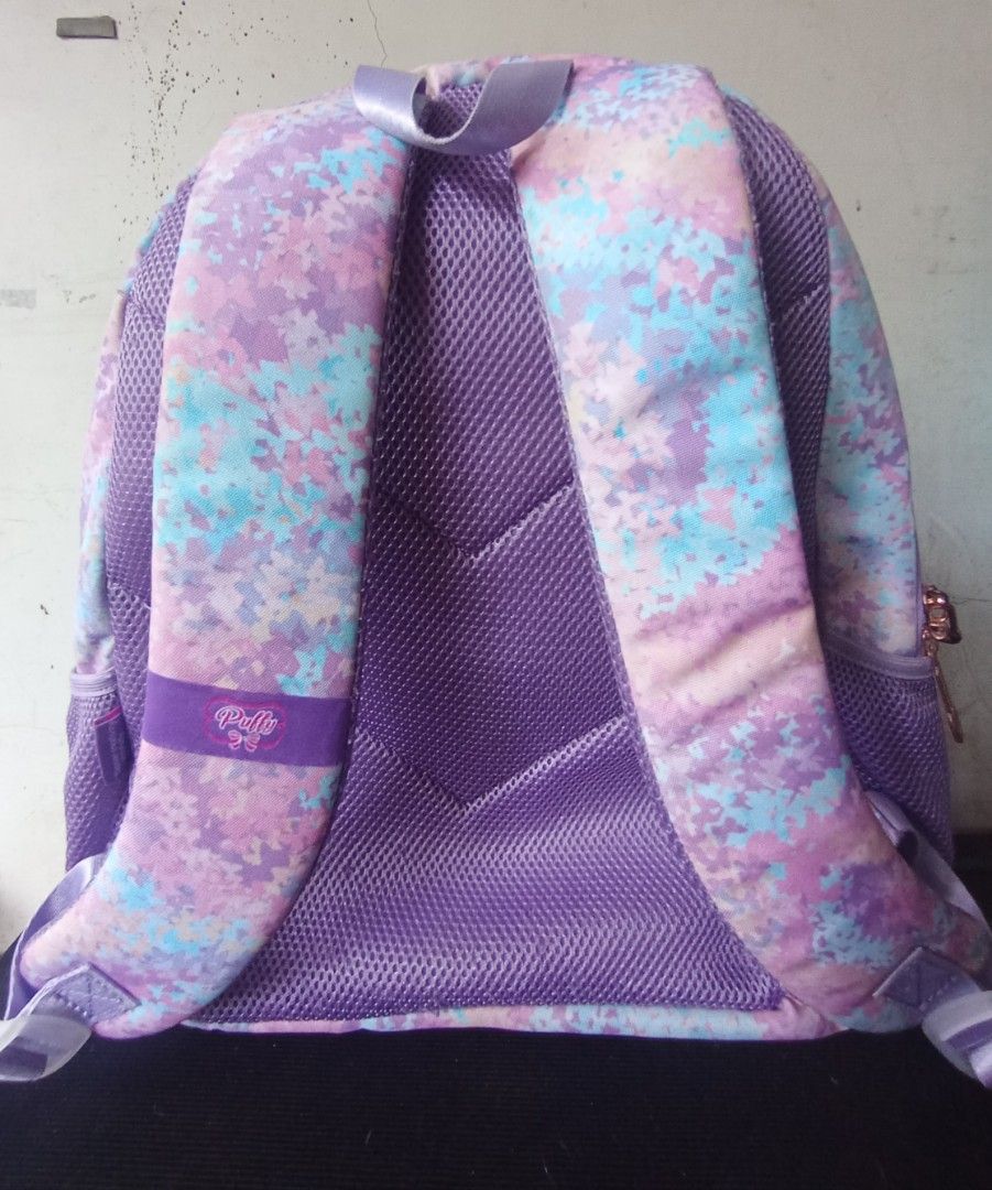 Puffy & Sparky School Bag (Category: Luxury Bags & Wallets) located in Quezon City. Submitted by cessswaaa30 (Listing ID 1441643639, Image 2). Description: a children's school bag set from the popular local brand Puffy & Sparky, specifically from one of their holographic textured pastel collections. Key Features Design & Pattern: Features a pastel purple, blue, and pink tie-dye pattern overlayed with clear quilted, iridescent front pockets. Brand