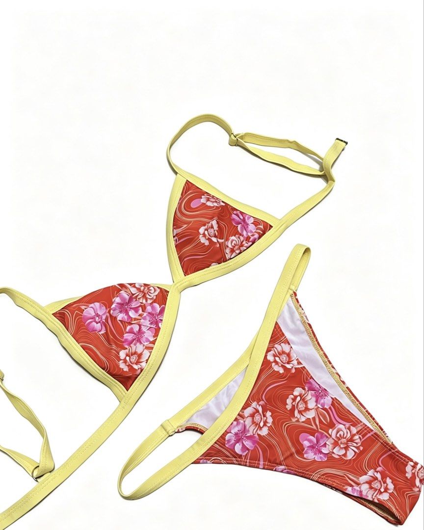 Orange Floral Bikini Set with Yellow Trim (Category: Bikinis & Swimsuits) located in Santa Rita. Submitted by dhaliaxoxox (Listing ID 1441671041, Image 1). Description: - Vibrant floral print bikini set - Red base with contrasting yellow trim - Classic triangle top - Cheeky bottom style - Adjustable straps for a perfect fit - Ideal for beach or pool days.